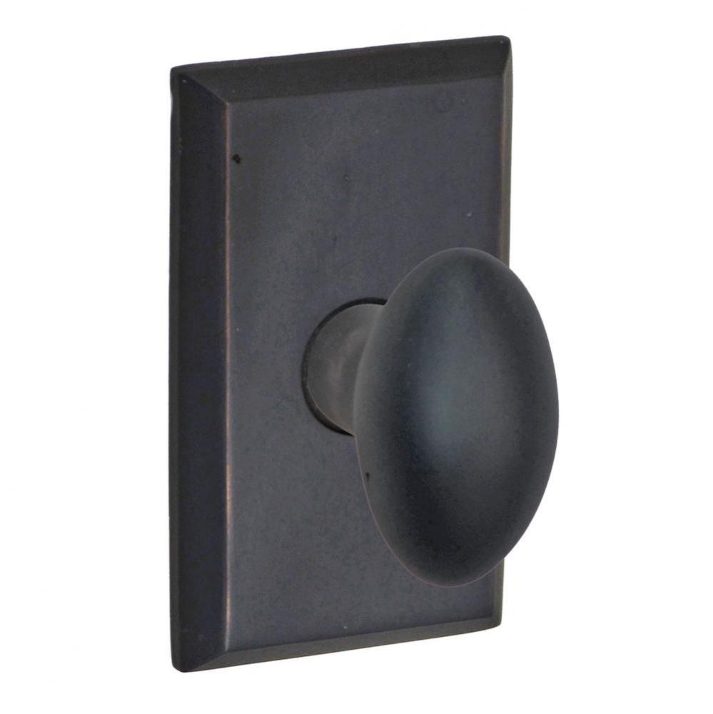 Sandcast Brass Egg Knob with Sandcast Brass Comstock Rose Privacy Set in Oil Rubbed