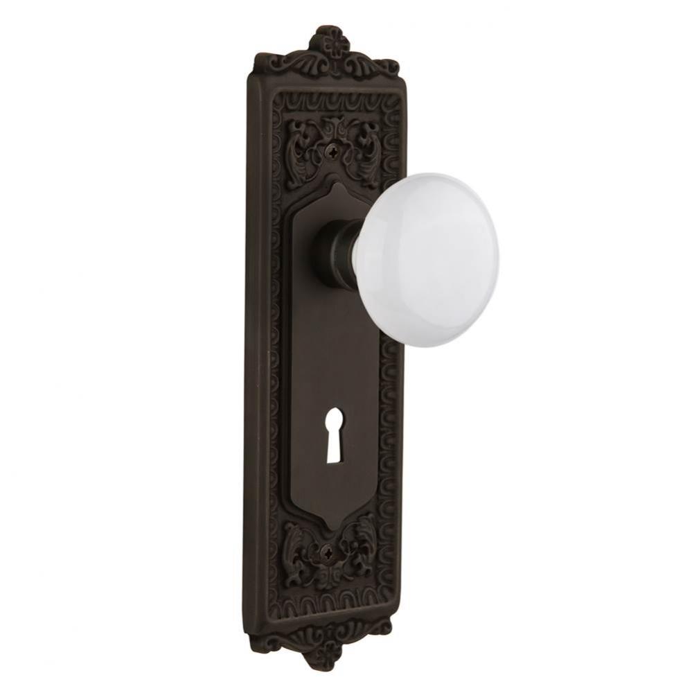 Nostalgic Warehouse Egg & Dart Plate with Keyhole Privacy White Porcelain Door Knob in Oil-Rub