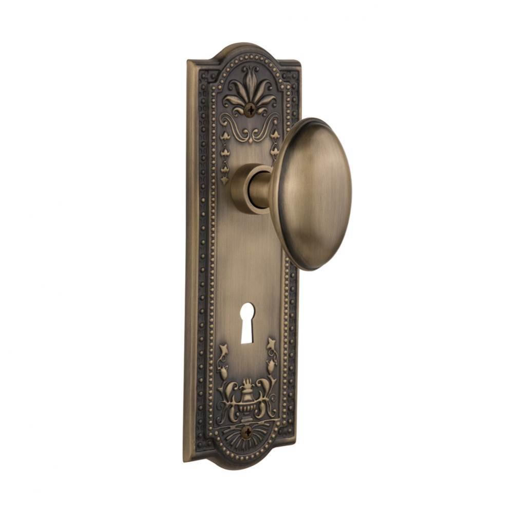 Nostalgic Warehouse Meadows Plate with Keyhole Privacy Homestead Door Knob in Antique Brass