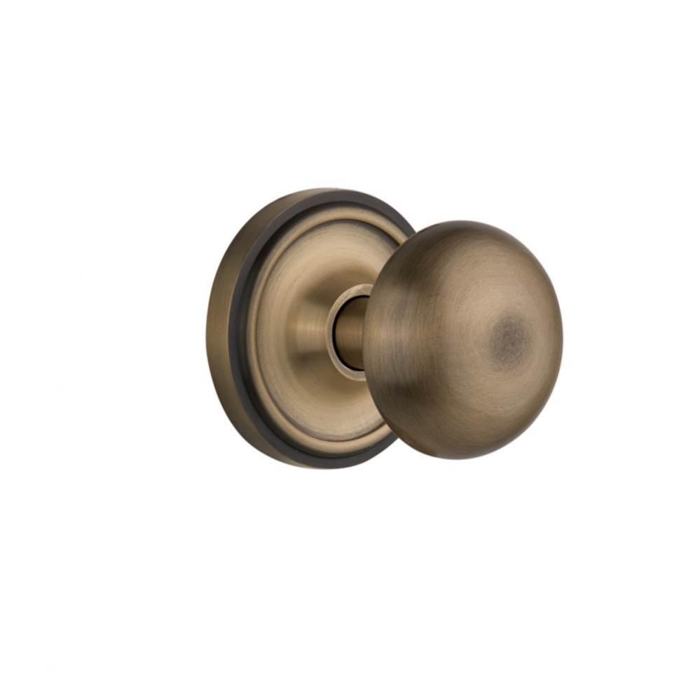 Nostalgic Warehouse Classic Rosette Passage New York Door Knob in Antique Brass