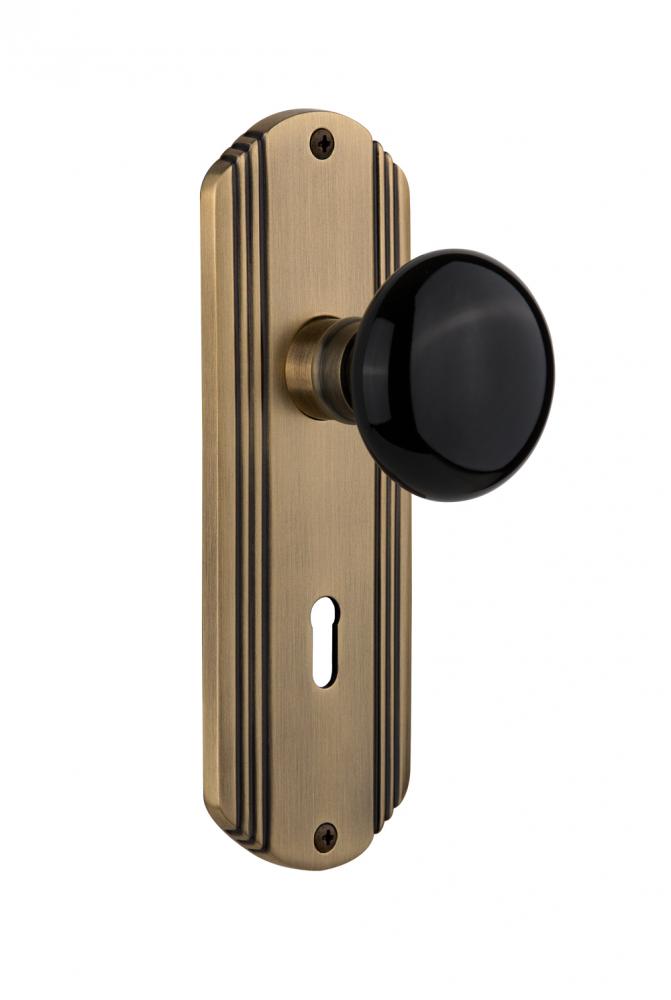 Nostalgic Warehouse Deco Plate with Keyhole Privacy Black Porcelain Door Knob in Antique Brass