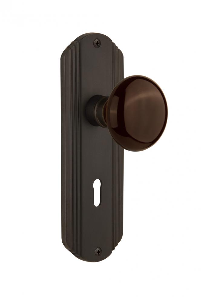 Nostalgic Warehouse Deco Plate with Keyhole Passage Brown Porcelain Door Knob in Oil-Rubbed Bronze