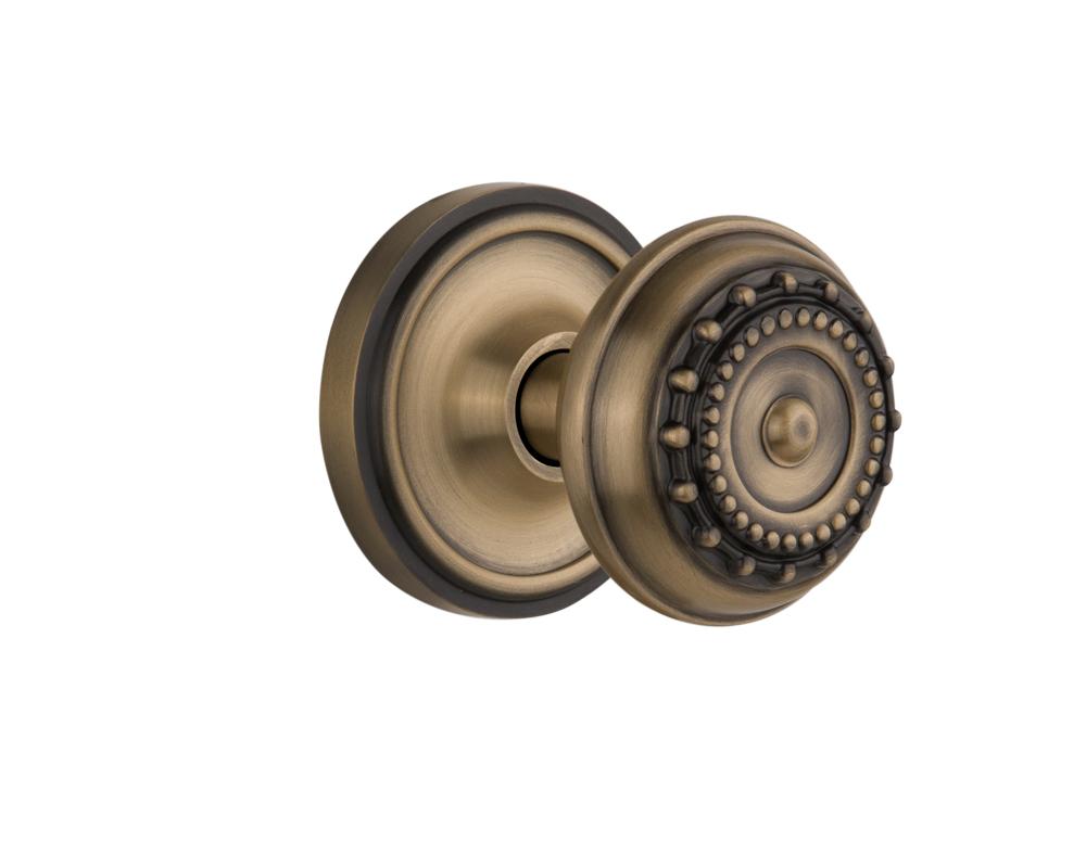 Nostalgic Warehouse Classic Rosette Passage Meadows Door Knob in Antique Brass