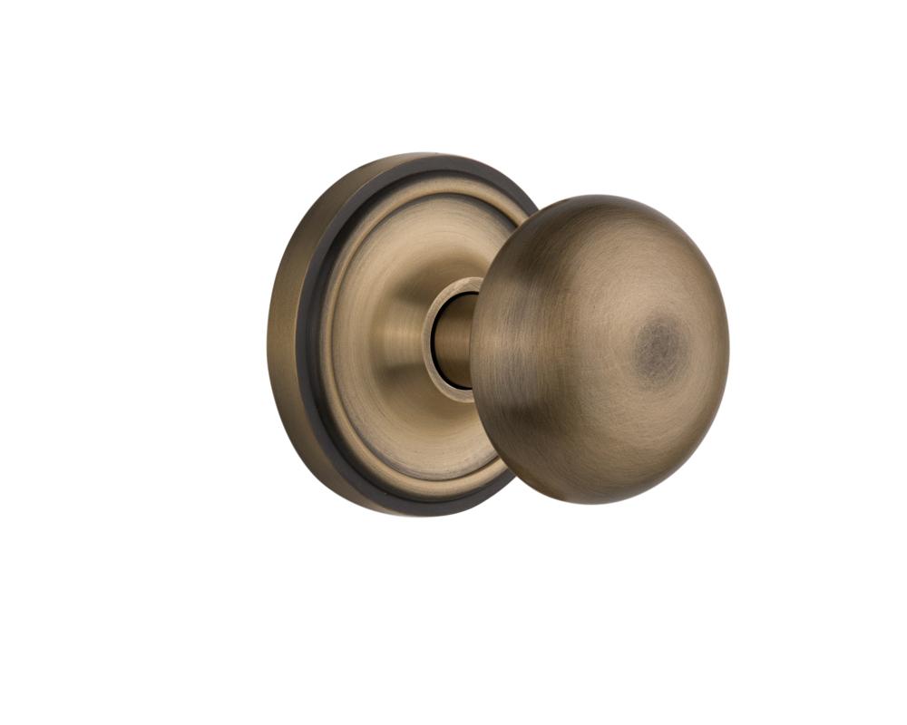 Nostalgic Warehouse Classic Rosette Passage New York Door Knob in Antique Brass