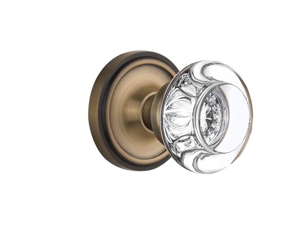 Nostalgic Warehouse Classic Rosette Passage Round Clear Crystal Glass Door Knob in Antique Brass