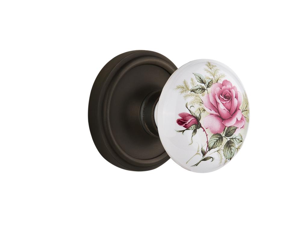 Nostalgic Warehouse Classic Rosette Passage White Rose Porcelain Door Knob in Oil-Rubbed Bronze