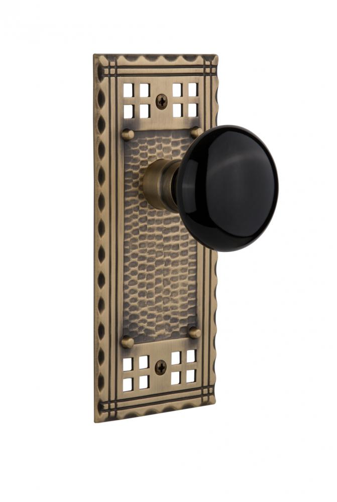 Nostalgic Warehouse Craftsman Plate Passage Black Porcelain Door Knob in Antique Brass