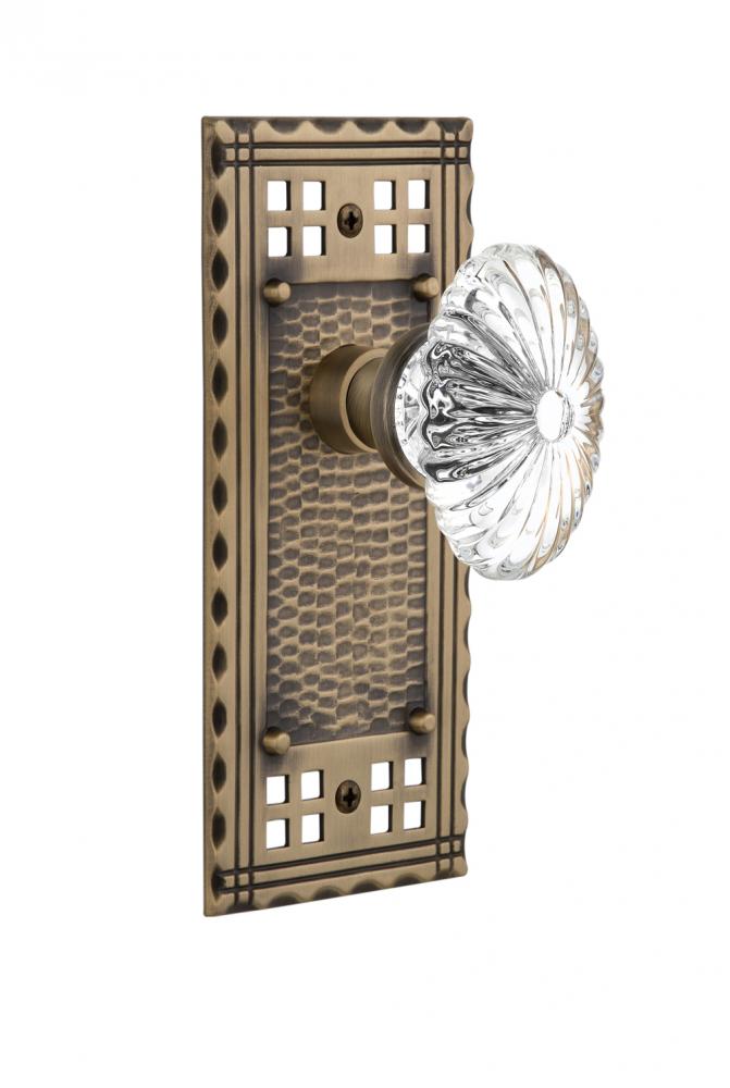 Nostalgic Warehouse Craftsman Plate Passage Oval Fluted Crystal Glass Door Knob in Antique Brass