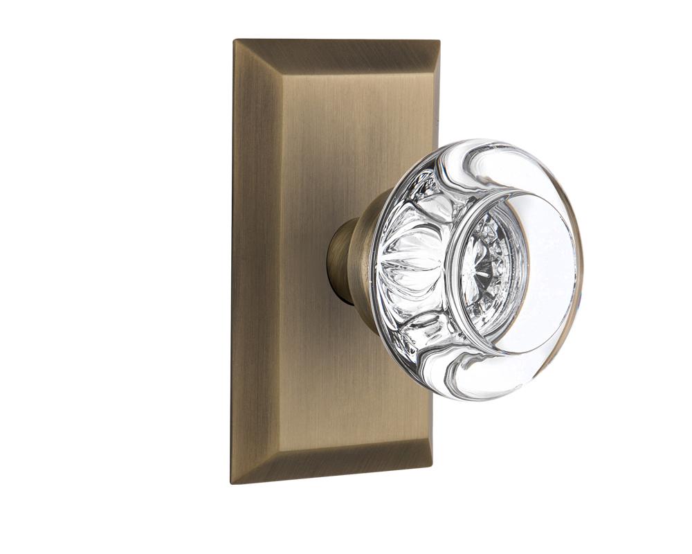 Nostalgic Warehouse Studio Plate Passage Round Clear Crystal Glass Door Knob in Antique Brass