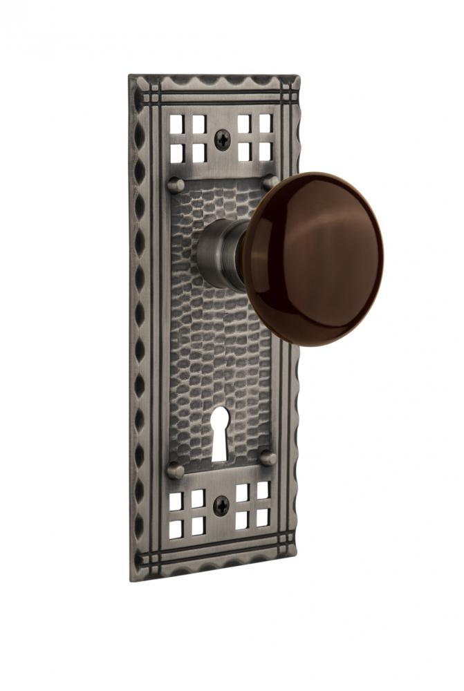 Nostalgic Warehouse Craftsman Plate with Keyhole Passage Brown Porcelain Door Knob in Antique Pewt