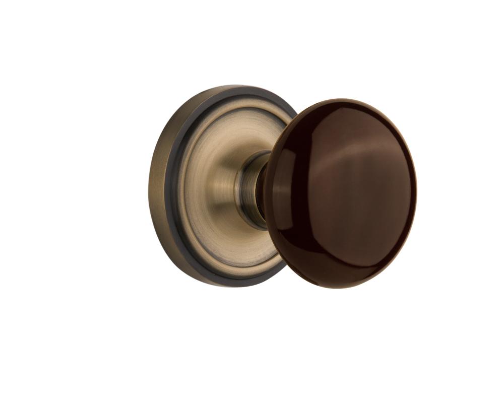 Nostalgic Warehouse Classic Rosette Double Dummy Brown Porcelain Door Knob in Antique Brass