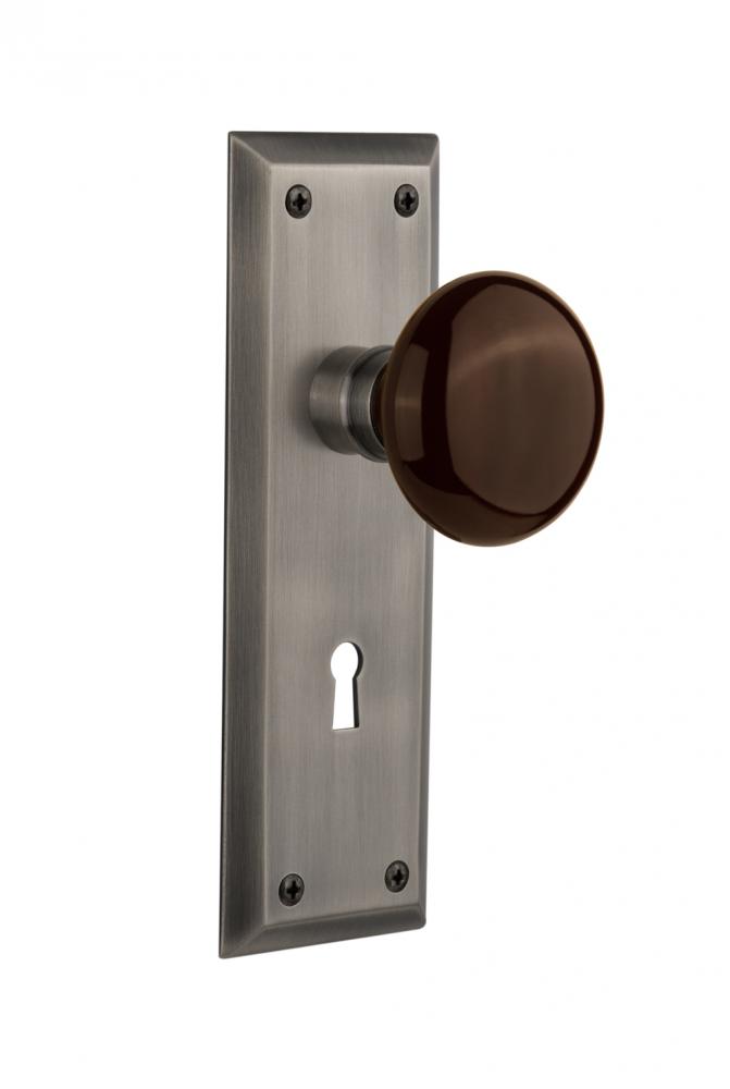 Nostalgic Warehouse New York Plate with Keyhole Privacy Brown Porcelain Door Knob in Antique Pewte