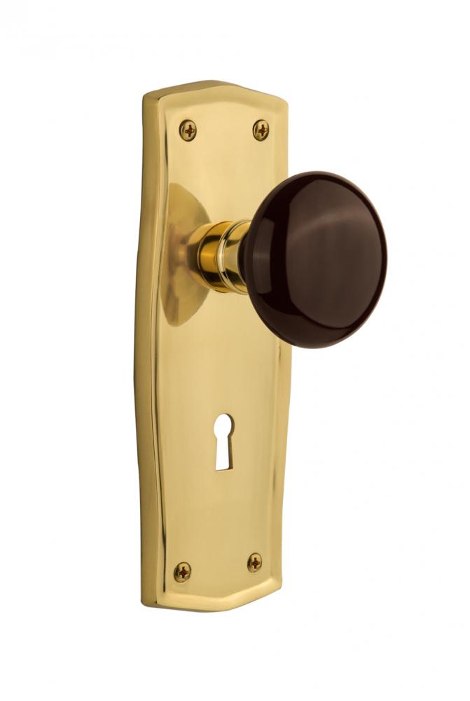 Nostalgic Warehouse Prairie Plate with Keyhole Privacy Brown Porcelain Door Knob in Polished Brass