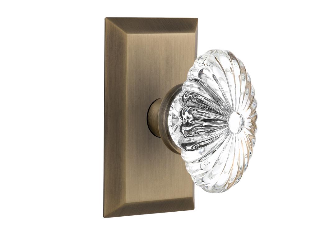 Nostalgic Warehouse Studio Plate Passage Oval Fluted Crystal Glass Door Knob in Antique Brass