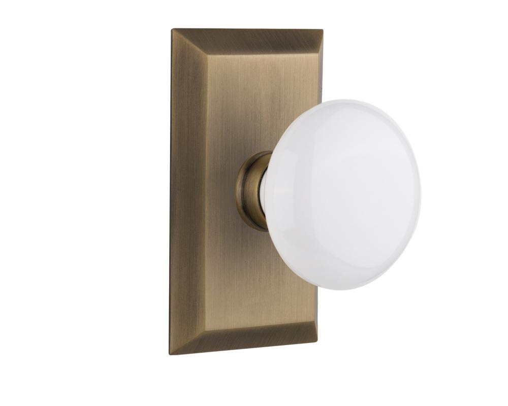 Nostalgic Warehouse Studio Plate Passage White Porcelain Door Knob in Antique Brass