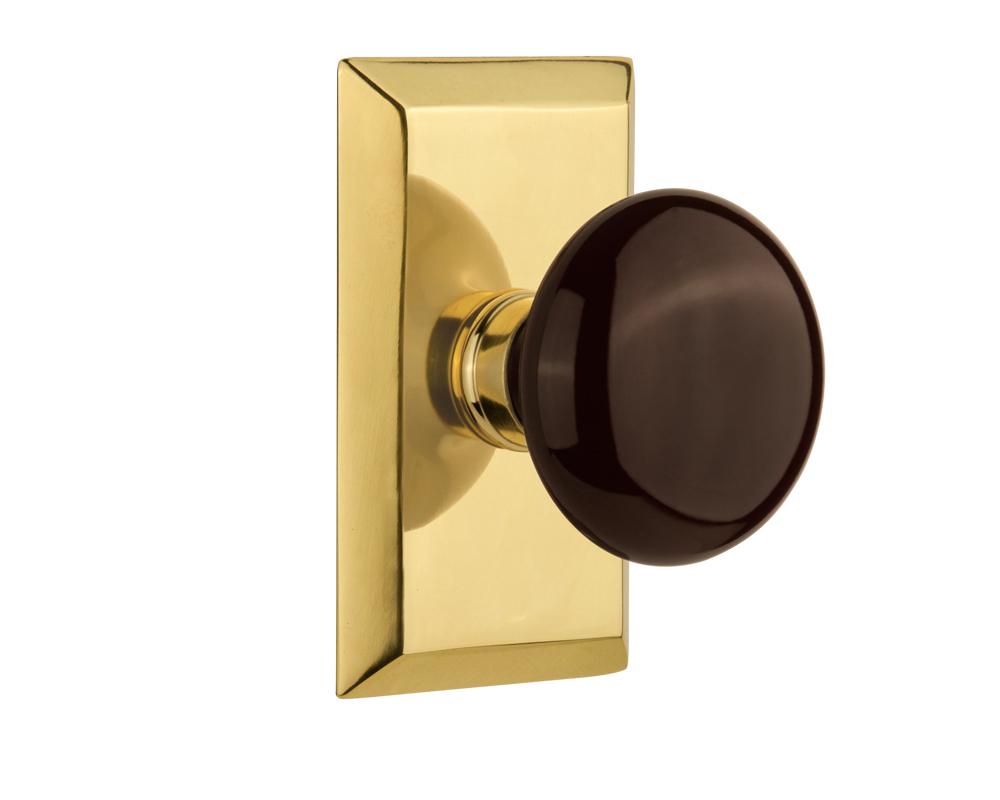 Nostalgic Warehouse Studio Plate Privacy Brown Porcelain Door Knob in Polished Brass