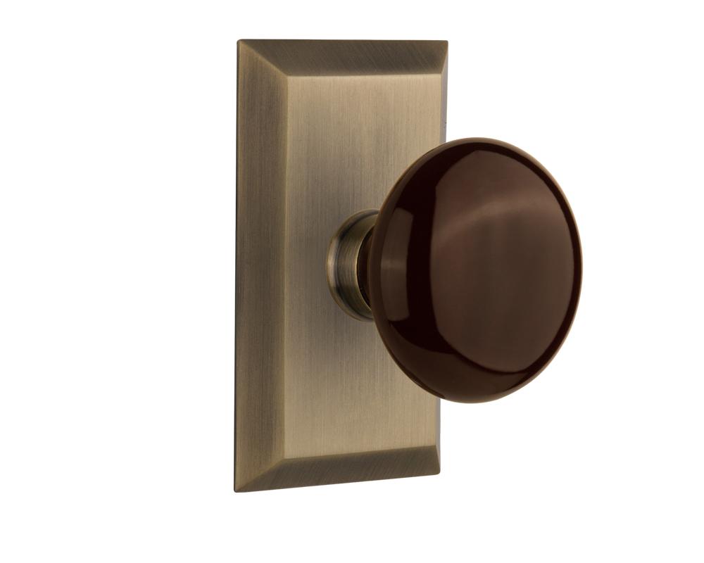 Nostalgic Warehouse Studio Plate Double Dummy Brown Porcelain Door Knob in Antique Brass
