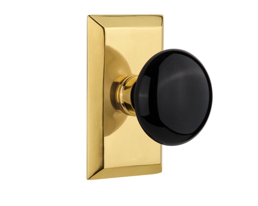 Nostalgic Warehouse Studio Plate Privacy Black Porcelain Door Knob in Polished Brass