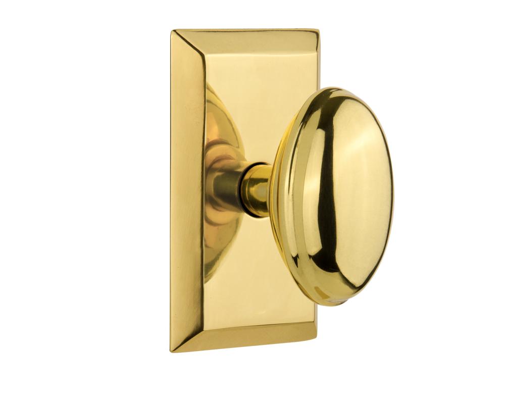 Nostalgic Warehouse Studio Plate Privacy Homestead Door Knob in Polished Brass