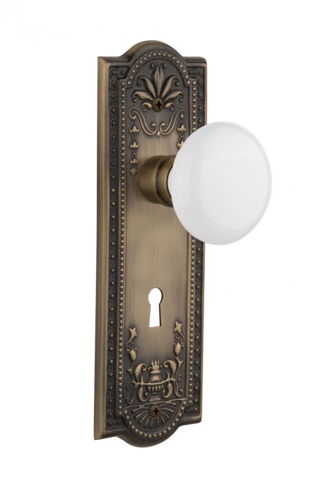 Nostalgic Warehouse Meadows Plate with Keyhole Privacy White Porcelain Door Knob in Antique Brass