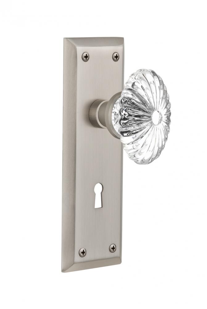 Nostalgic Warehouse New York Plate with Keyhole Privacy Oval Fluted Crystal Glass Door Knob in Sat