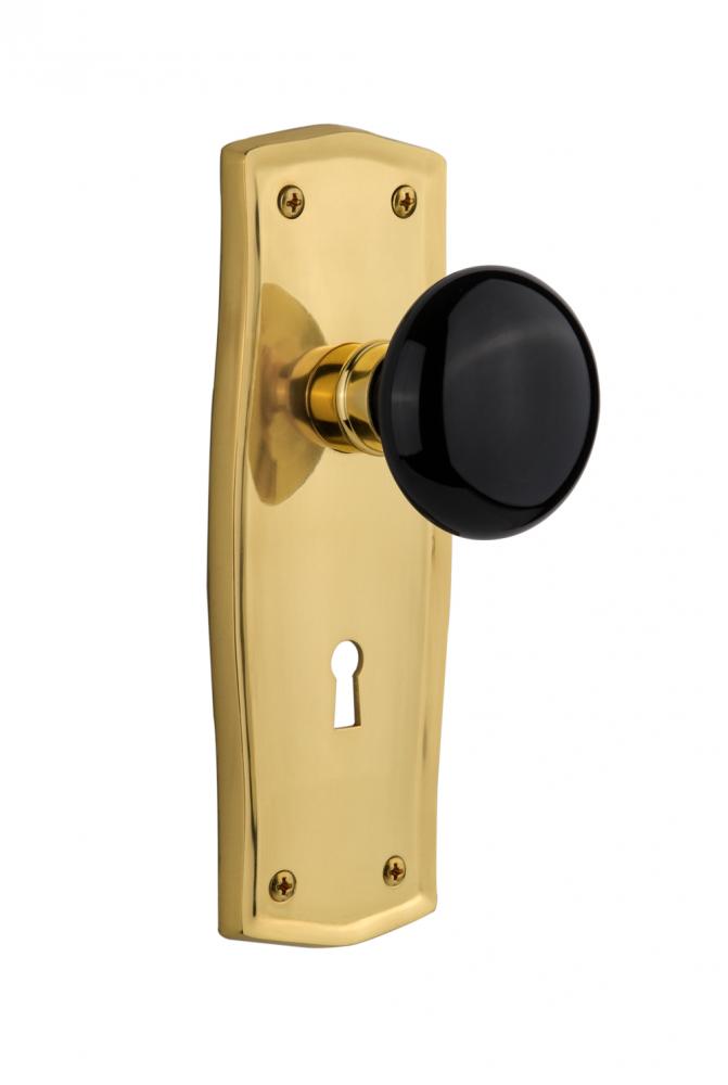 Nostalgic Warehouse Prairie Plate with Keyhole Privacy Black Porcelain Door Knob in Polished Brass