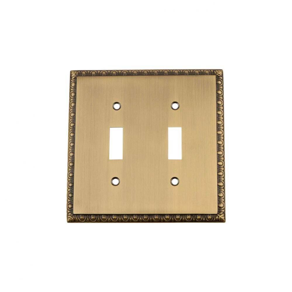 Nostalgic Warehouse Egg & Dart Switch Plate with Double Toggle in Antique Brass