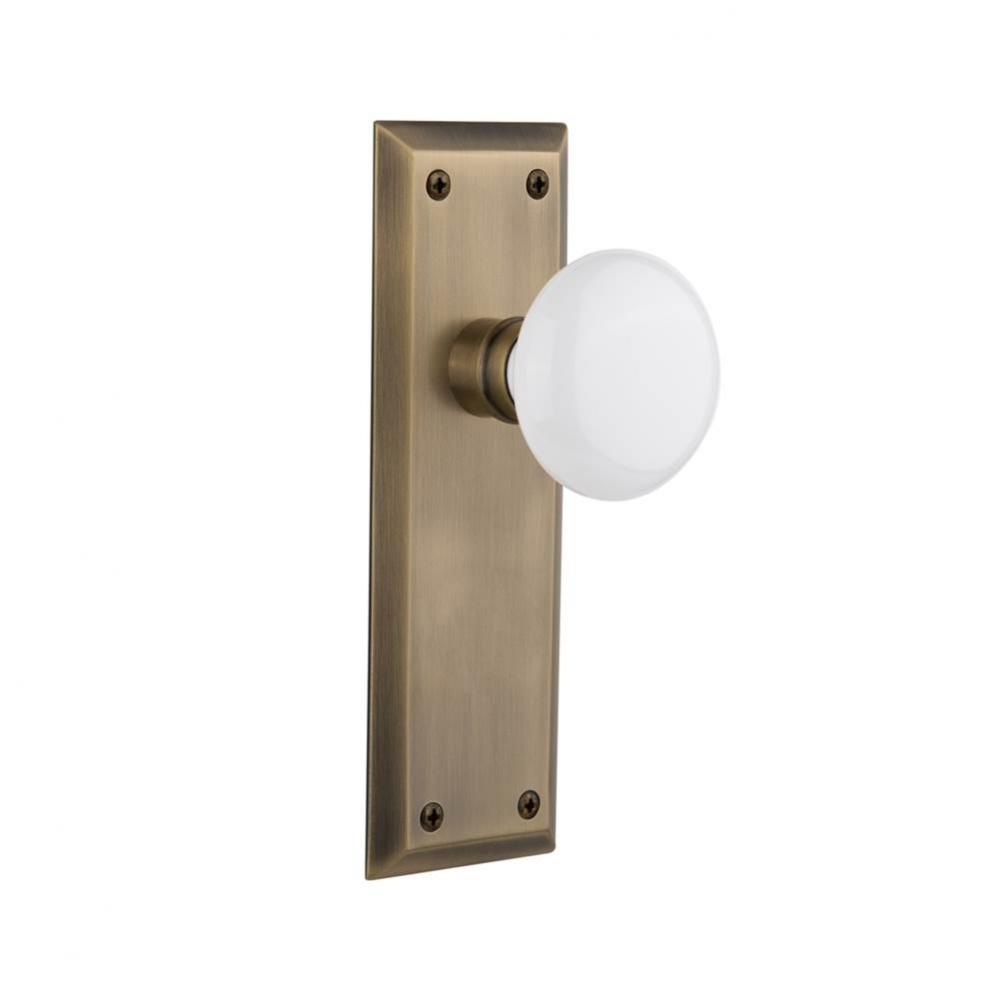 Nostalgic Warehouse New York Plate Double Dummy White Porcelain Door Knob in Antique Brass