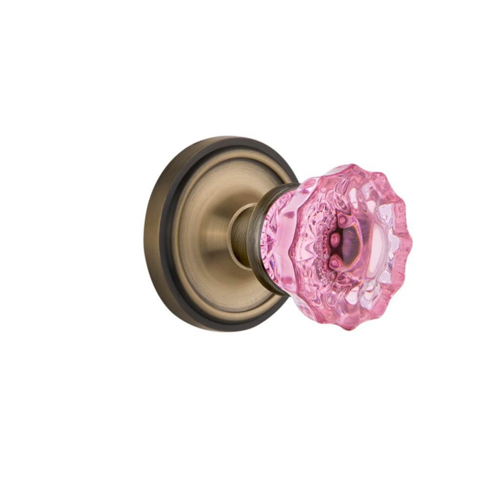 Nostalgic Warehouse Classic Rosette Passage Crystal Pink Glass Door Knob in Antique Brass