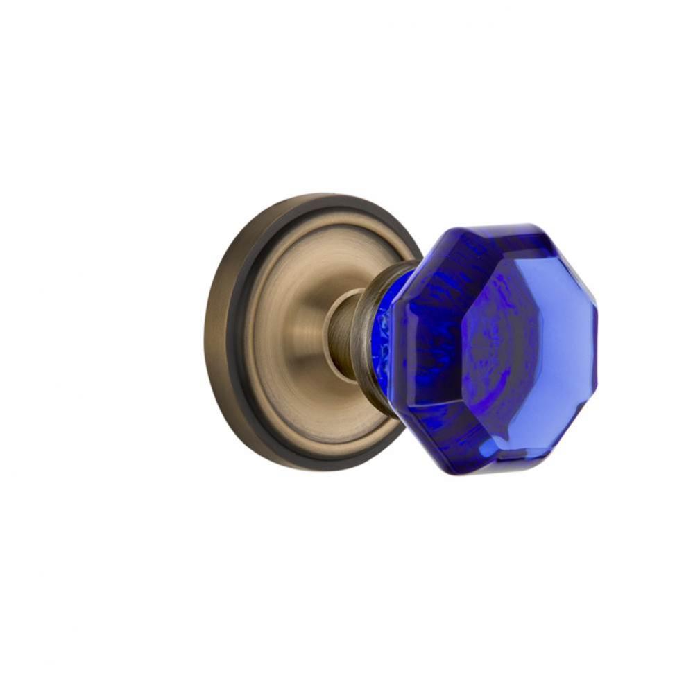 Nostalgic Warehouse Classic Rosette Passage Waldorf Cobalt Door Knob in Antique Brass