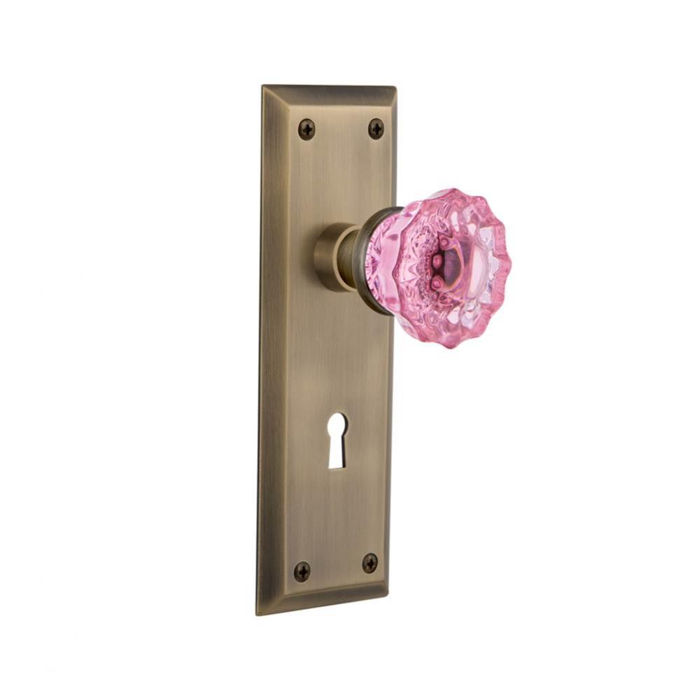Nostalgic Warehouse New York Plate with Keyhole Passage Crystal Pink Glass Door Knob in Antique Br