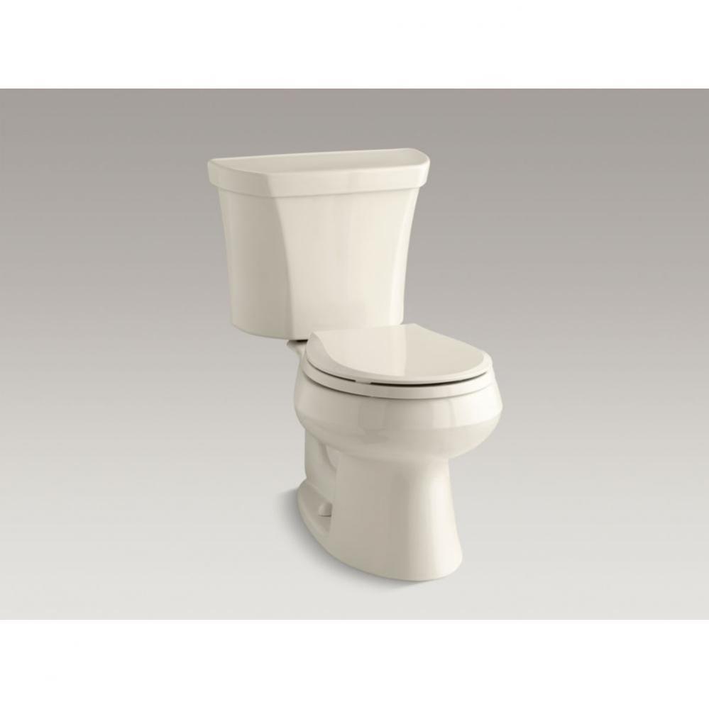 Wellworth® Two piece round front dual flush toilet with right hand trip lever