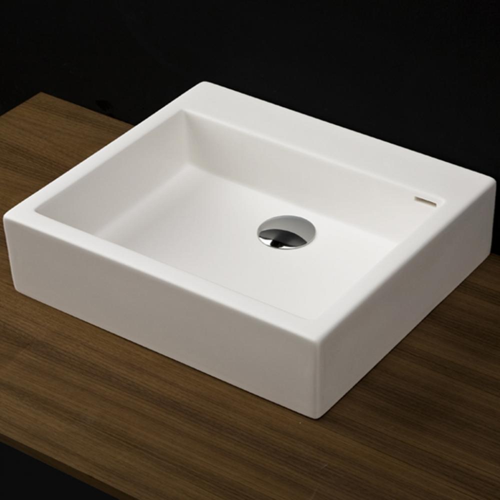 Vessel Bathroom Sink made of solid surface, with an overflow.