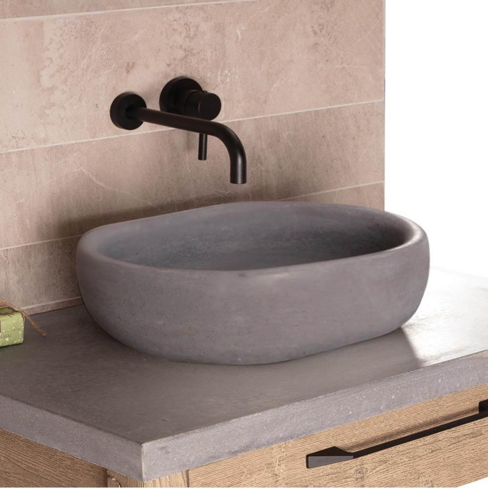 Vessel sink made of concrete, no overflow.