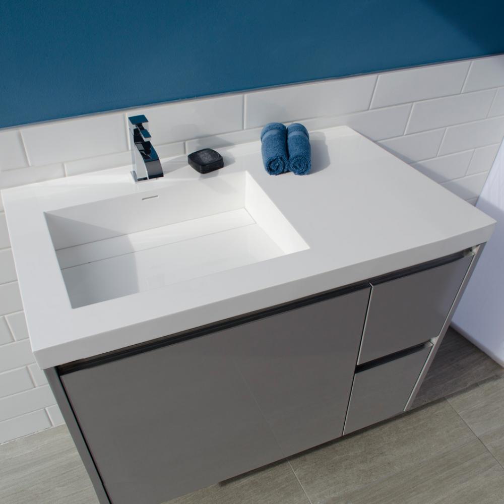 Vanity-top Bathroom Sink made of solid surface, with an overflow and decorative drain cover. Sink