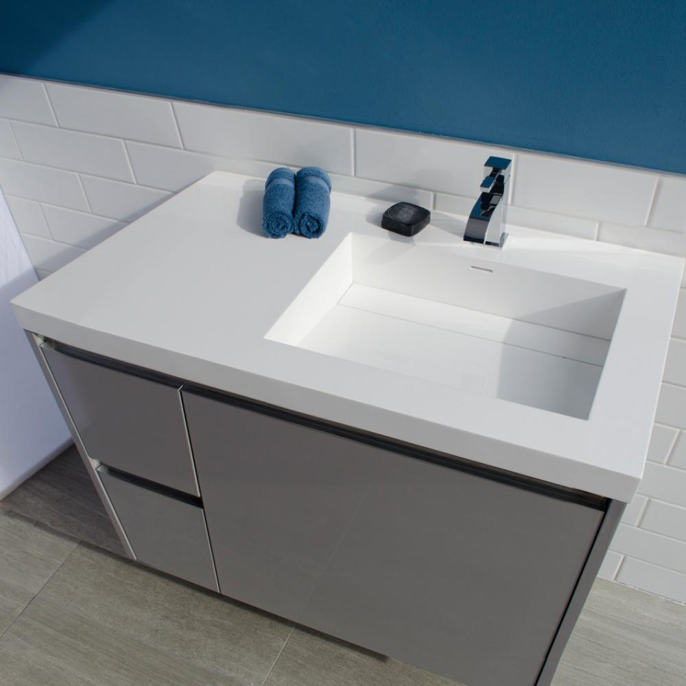 Vanity-top Bathroom Sink made of solid surface, with an overflow and decorative drain cover.