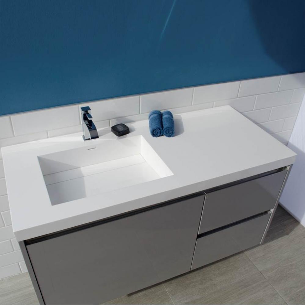 Vanity-top Bathroom Sink made of solid surface, with an overflow and decorative drain cover.