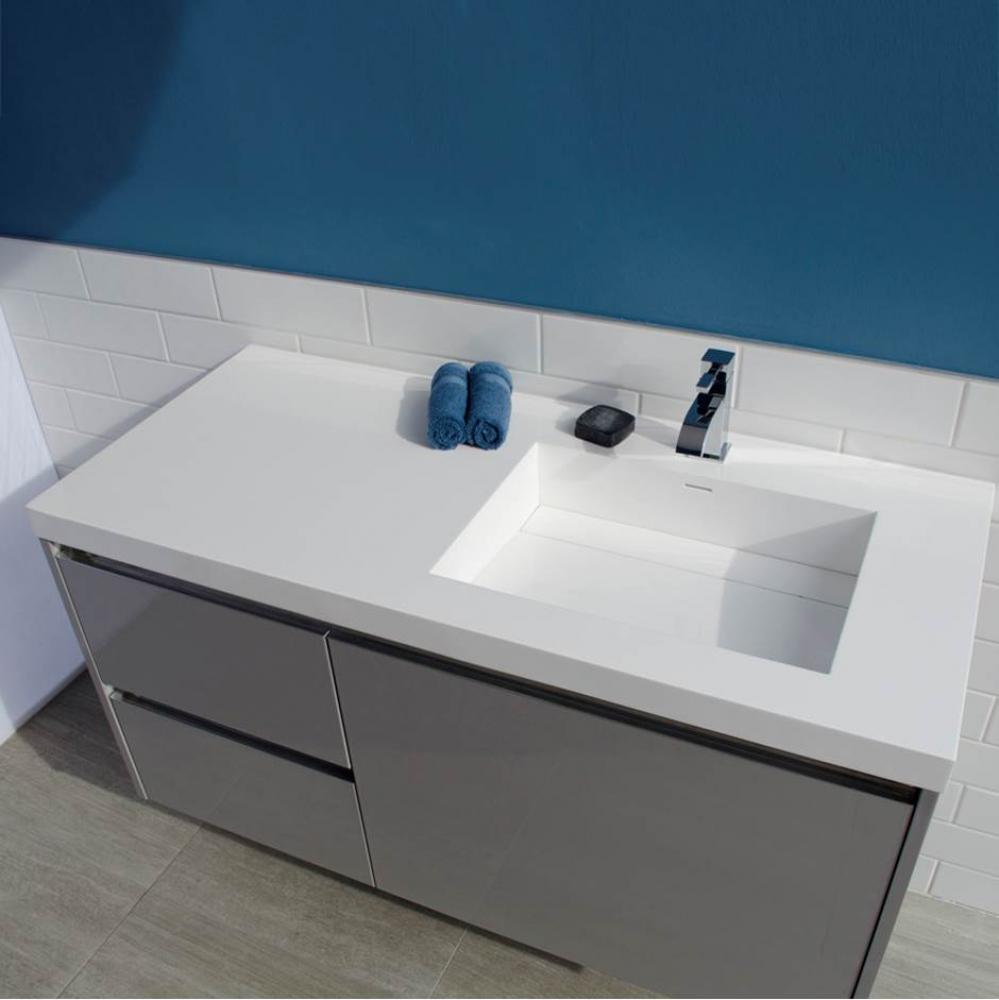 Vanity-top Bathroom Sink made of solid surface, with an overflow and decorative drain cover.
