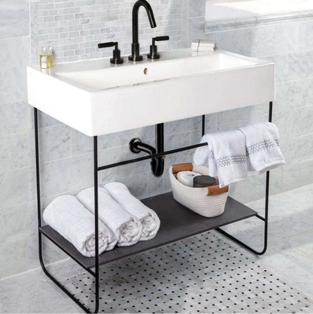 Floor-standing welded metal console stand with a towel bar and shelf. It must be attached to wall.