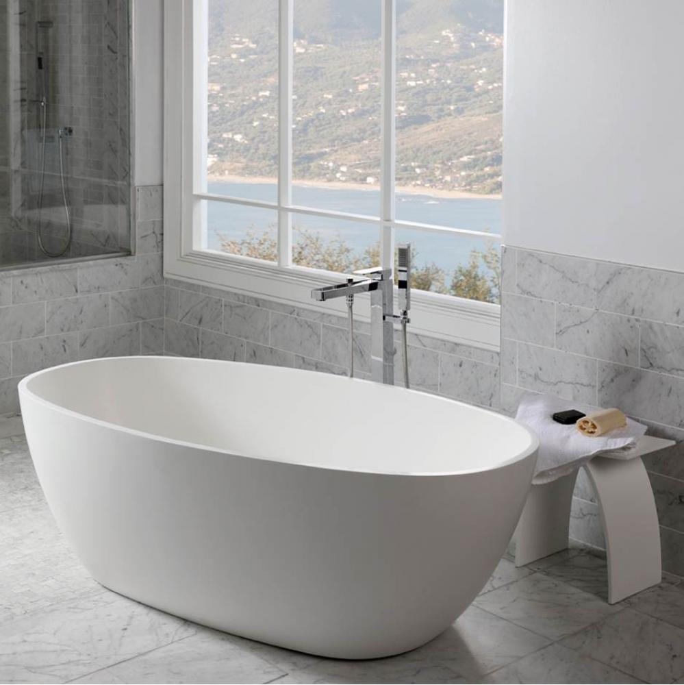 Free-standing soaking bathtub made of white solid surface with an overflow and a decorative solid