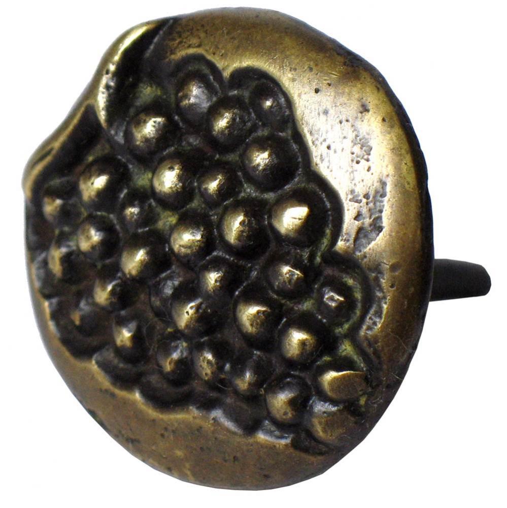 Round brass clavo, grape motif