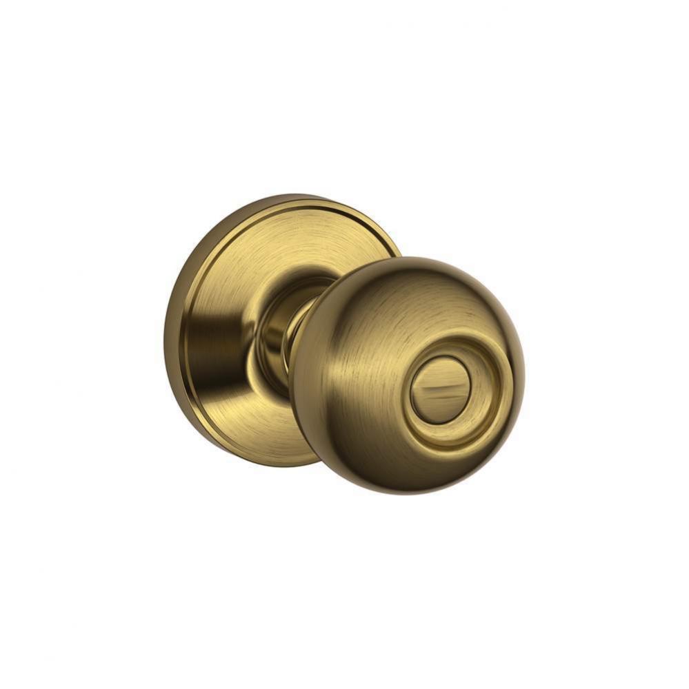 Corona Knob Bed and Bath Lock in Antique Brass